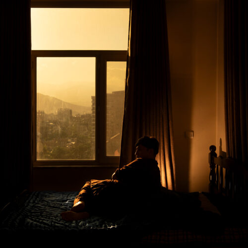 KABUL | KABUL | AFGHANISTAN | 2024-05-13 |  Samir, 30, is a transwoman who crossdressed in private spaces but present as a man in public, due to the stigma attached to being a member of LGBTQi+.

My mother died 2 weeks ago, now the family is pressuring me to marry off my eldest daughter, so I told them my mother had just died, and we need to mourn for three months. Before, the threats were with society, now the threats are within my own family.
It started from a very young age, 12 or 13, I loved wearing girl’s clothes and putting on make-up, I liked to hang out with girls, sat with them, but once I became a teenager, I really wanted to get close to the boys, and had dreams about them. Everybody in the family blamed me for how I dressed and behaved, except my biological mother, she wouldn’t say anything.
When I was young, my mother understood I didn’t like girls, and when my family told me they want to marry me off, I ran away to Mazar, but there I was abused and rapped, it was so bad that I went back to Kabul, and my mother told me, just say yes, you’ll have peace.
Before the Taliban took over, I had two jobs, including as a sex worker, with a few other queer people. I couldn’t hold a job because they would immediately know I was trans and I would lose my job on the second or third day. So with some other trans people we would rent a room and work as sex workers. Two boys brought Taliban to our room, that’s when I was arrested for the first time. They tied our hands behind our back, and beat us with cables, and I was covered in bruises. When I went home, my wife understood I was trans, only the third time.